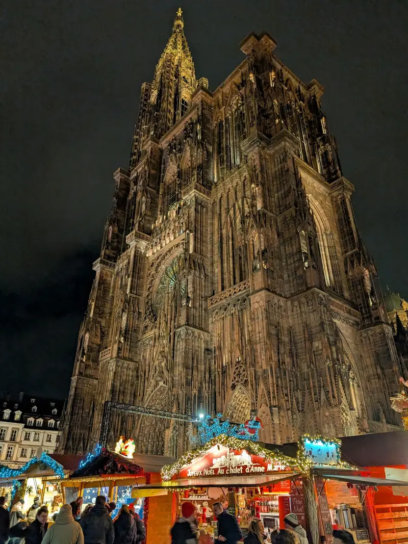 The cathedral tower straight up from the square — the Christmas market in Strasbourg, France