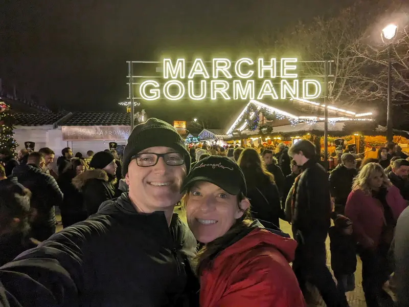 At the Marché Gourmand sign — the Christmas market in Paris, France