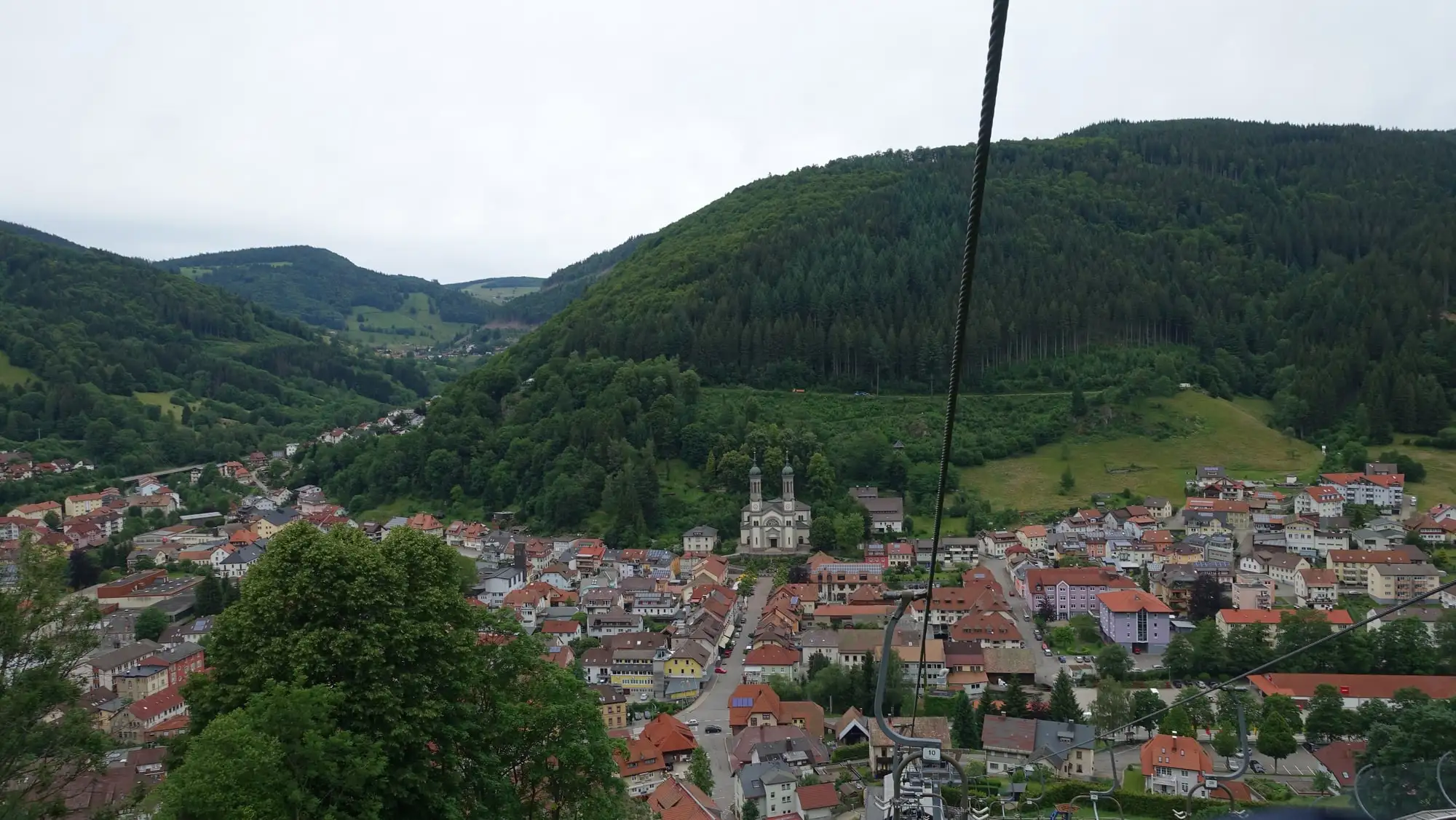A Black Forest town in its valley with forest on both sides, Germany