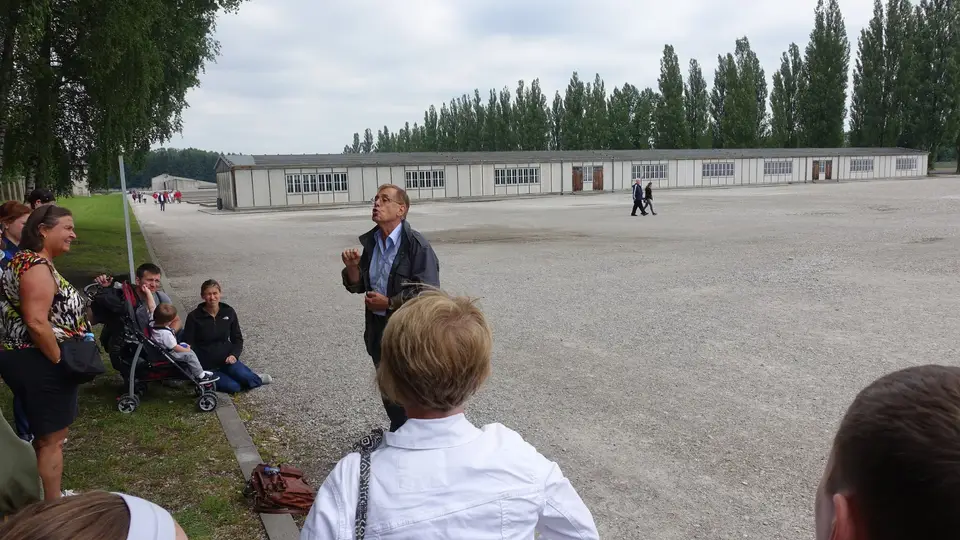 A guide on the roll-call ground at Dachau