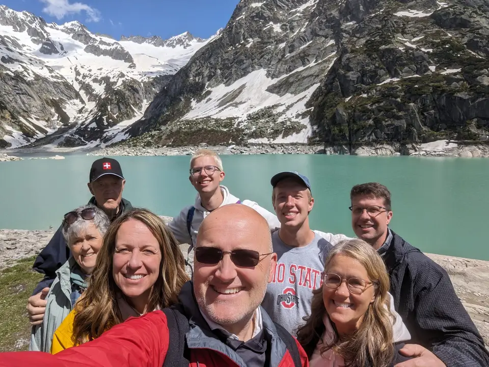 At the top, the lake and the peaks behind
