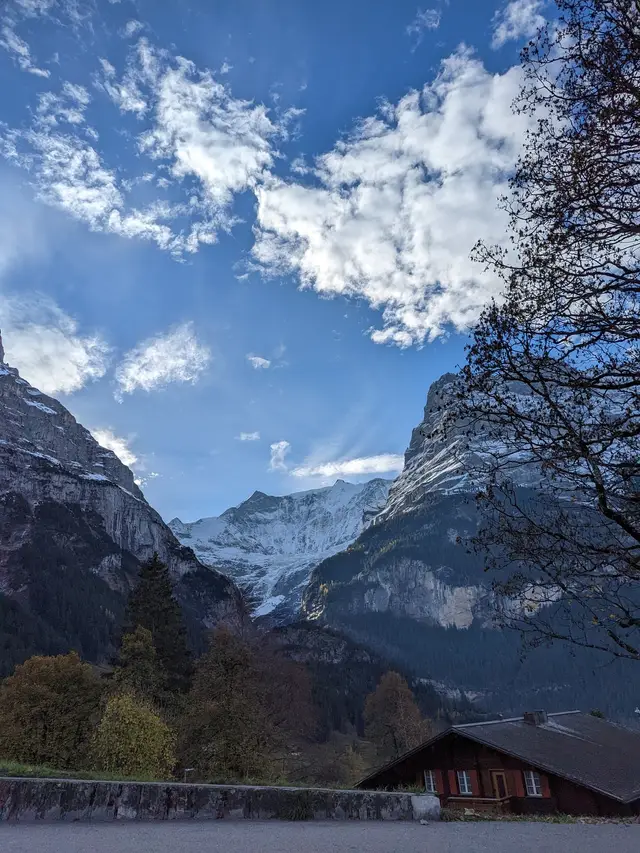 The face above the village, through the trees