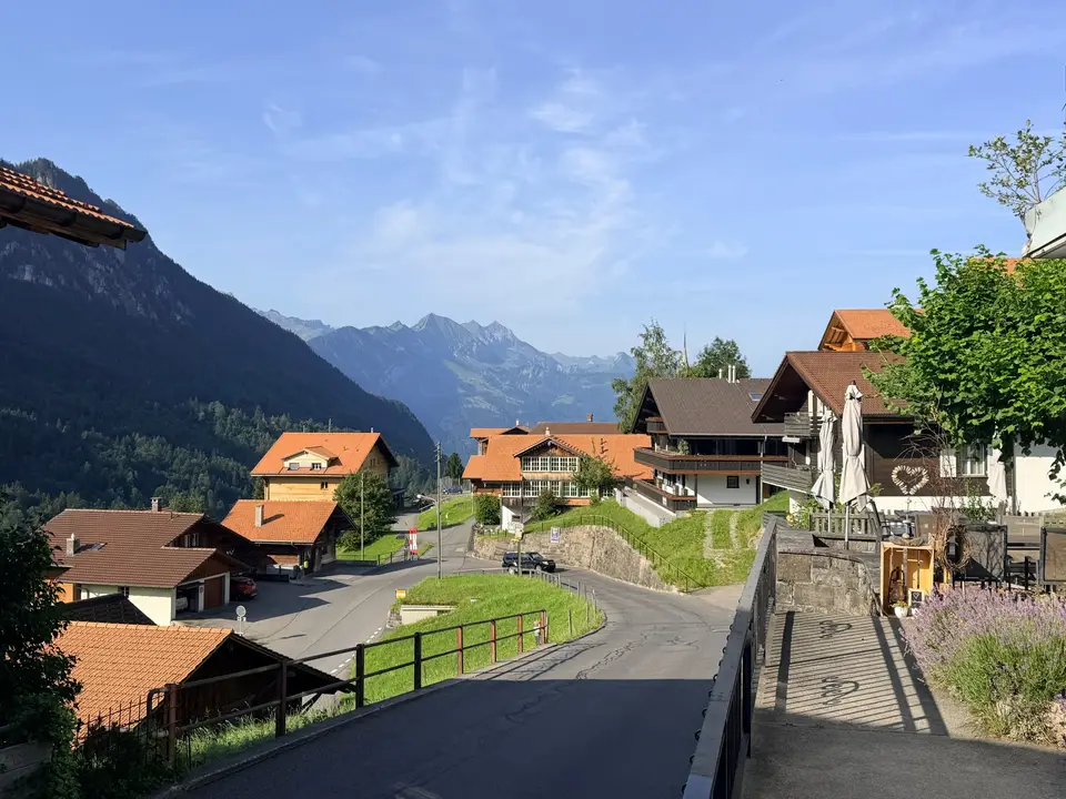 The road through the village, peaks beyond