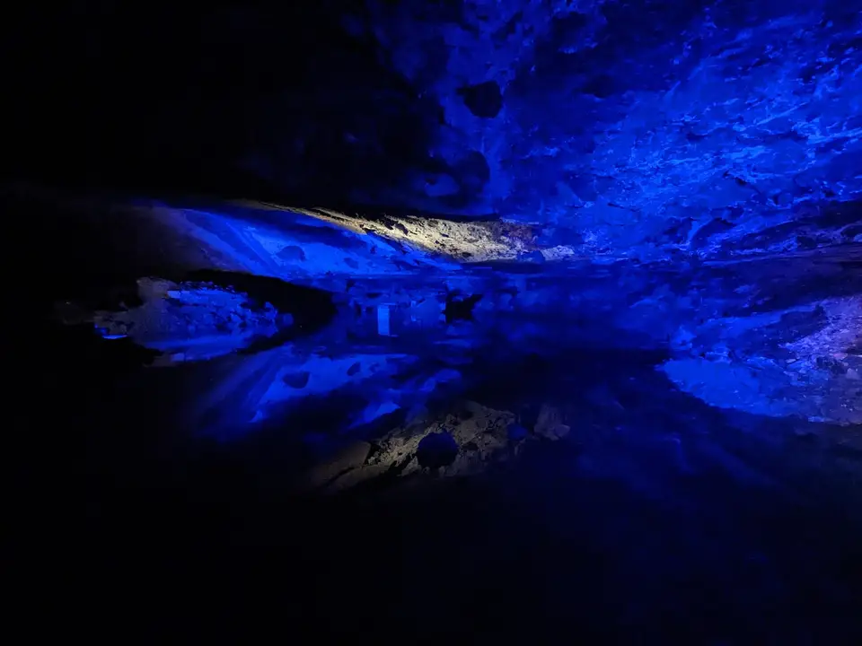 The underground lake lit blue