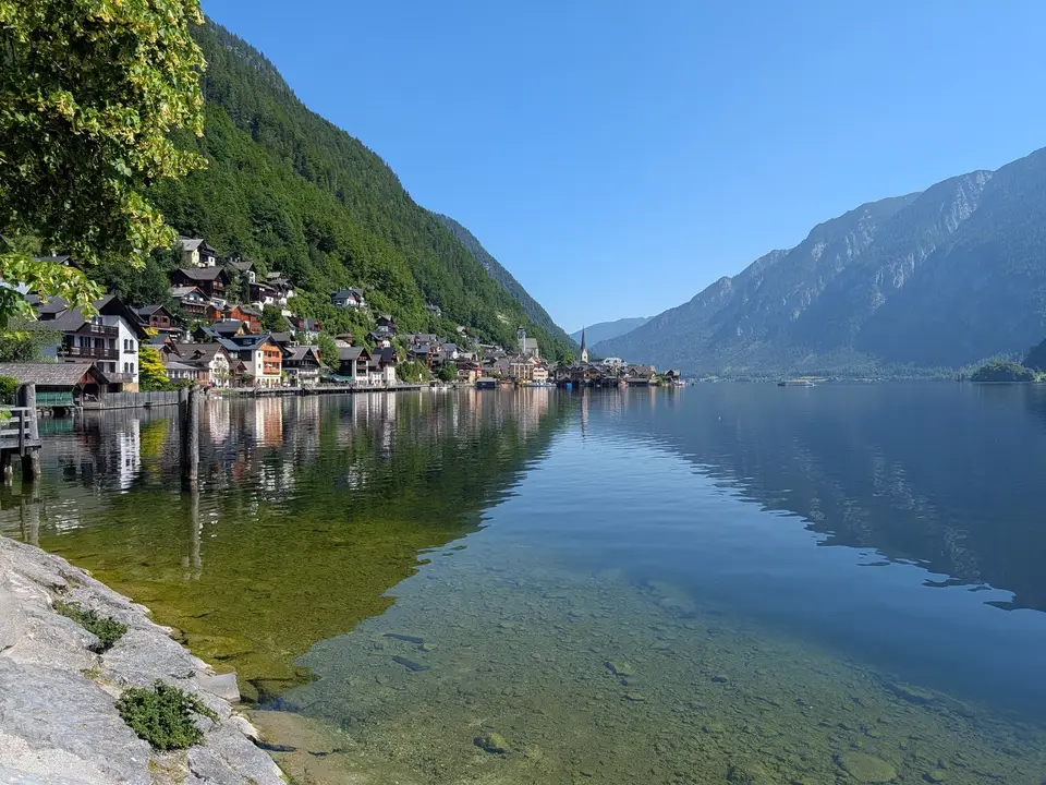 The village strung along the foot of the cliff