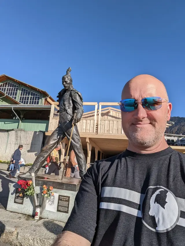 With the Freddie Mercury statue on the lakefront