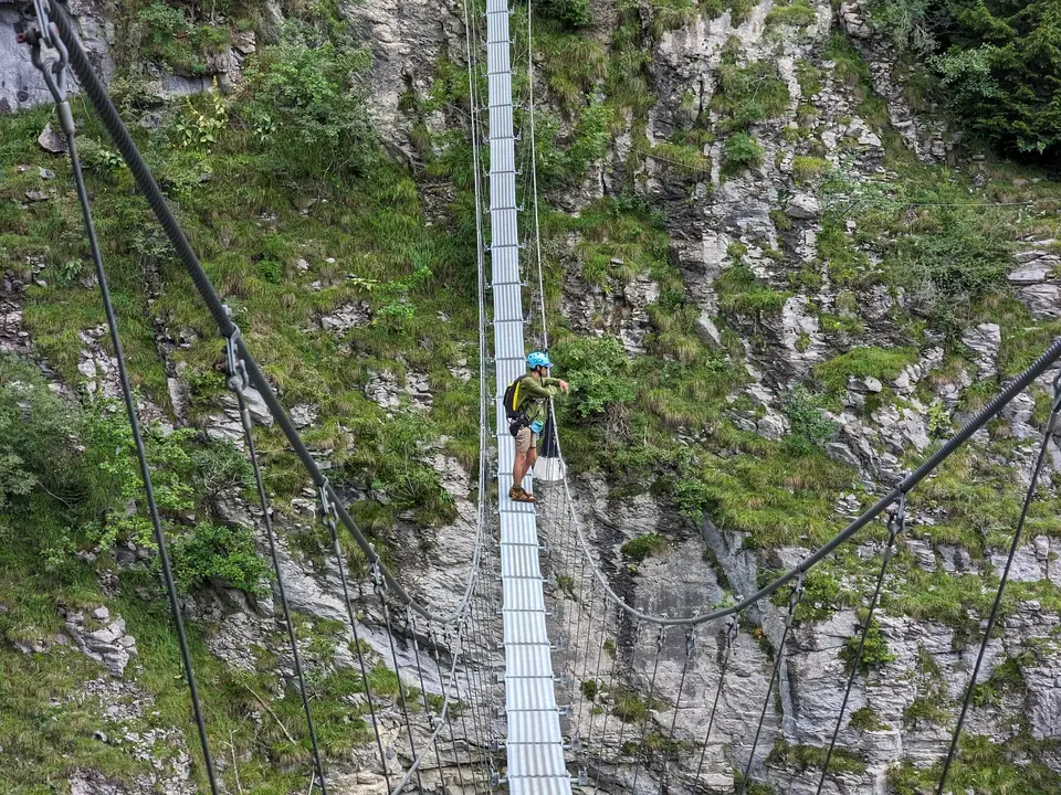 The suspension bridge on the path below the village