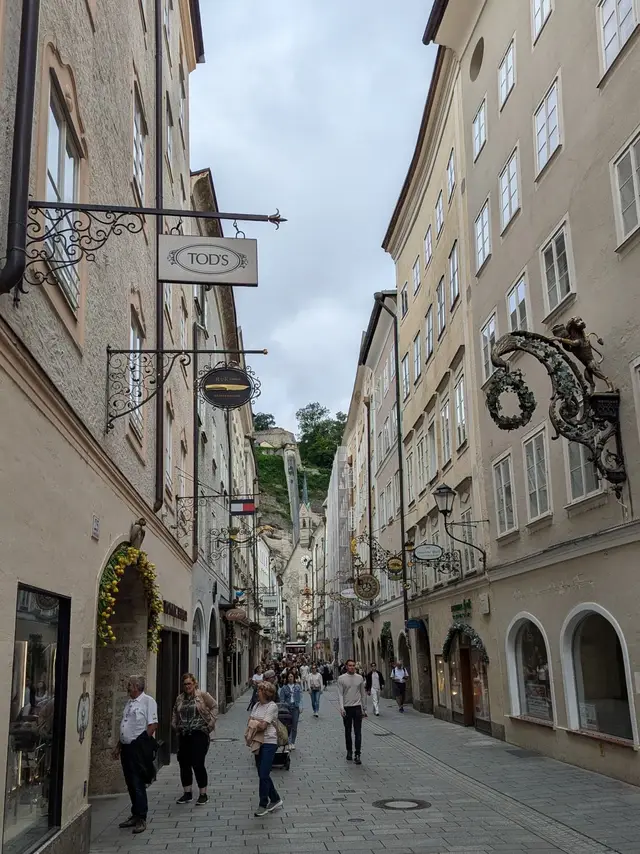 Getreidegasse and its wrought-iron shop signs