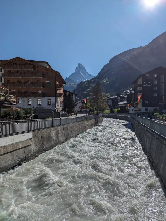 The river running hard through the middle of the village
